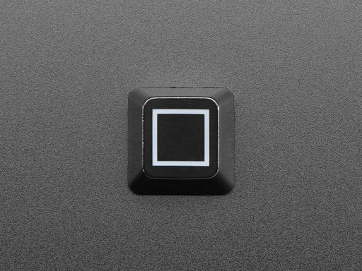 Close-up video of Zener ESP Square keycap glowing rainbow colors.