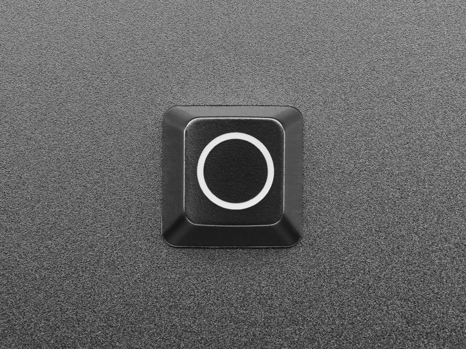 Close-up video of Zener ESP Circle keycap glowing rainbow colors.