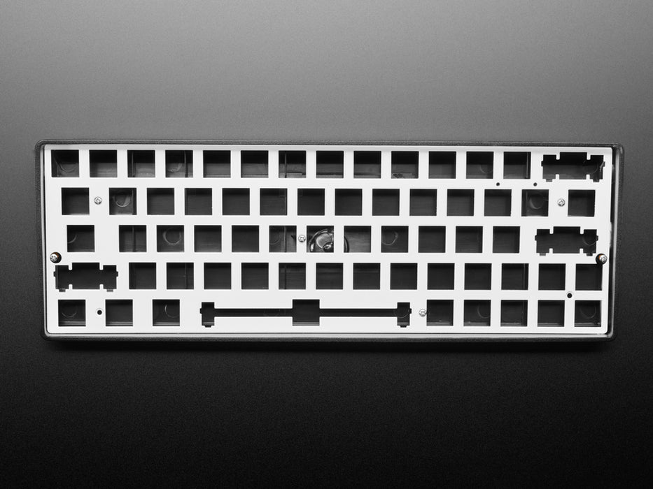 Angled shot of Silver Anodized Metal 60% / GH60 Keyboard Shell Plate.