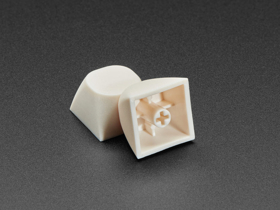 Angled shot of five milky white MA keycap.