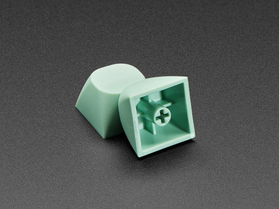 Angled shot of 10 mint screen MA keycaps.