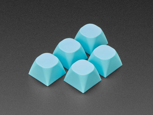 Angled shot of five cyan keycaps.