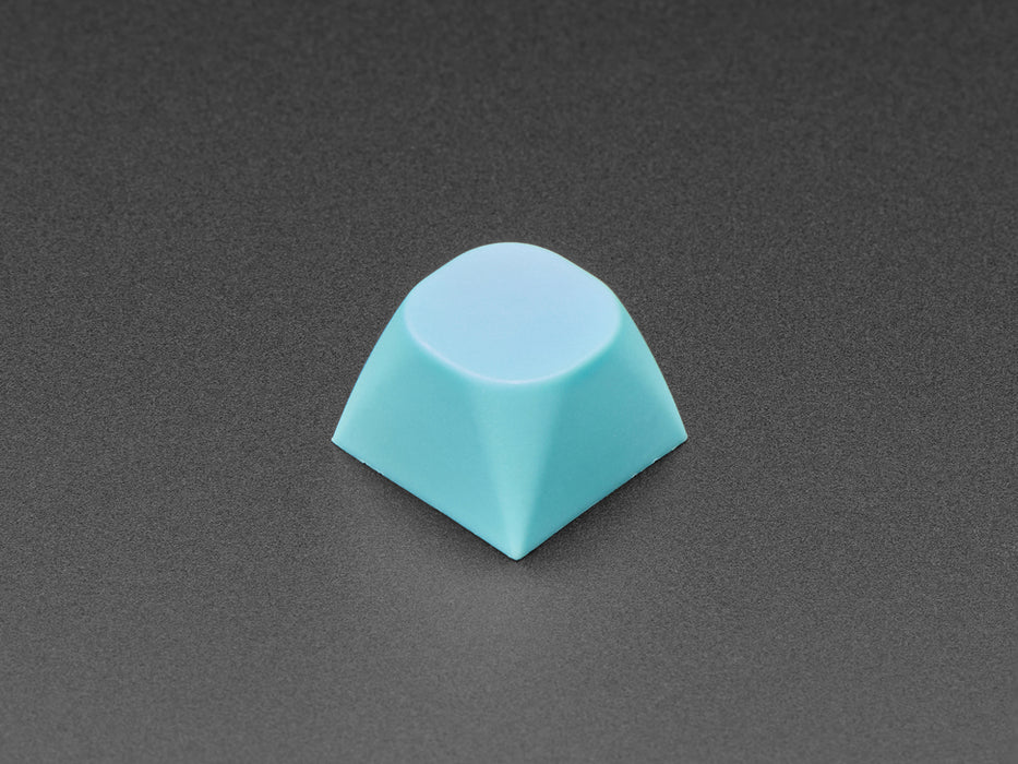 Angled shot of five cyan keycaps.