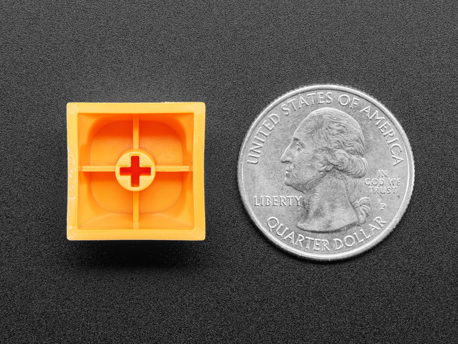 Angled shot of five orange MA keycaps.