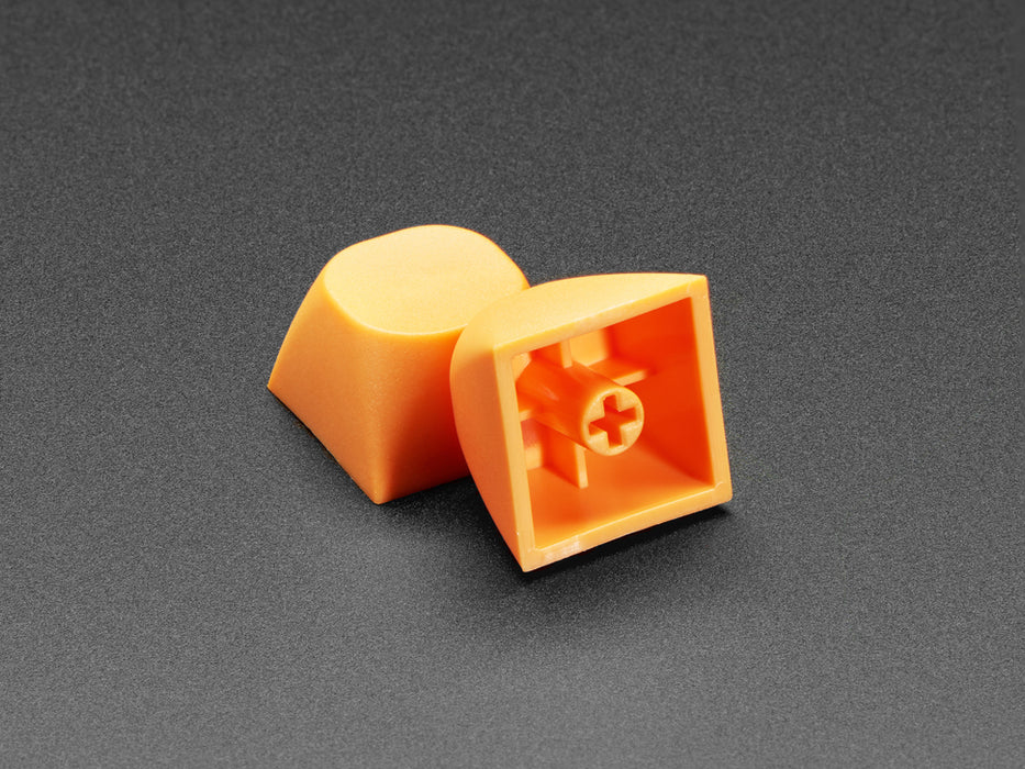 Angled shot of five orange MA keycaps.