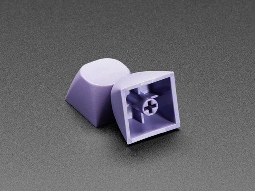 Angled shot of five purple keycaps.