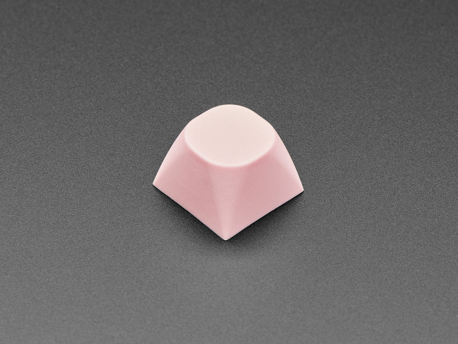 Angled shot of five pink MA keycaps.