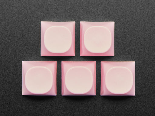 Angled shot of five pink MA keycaps.