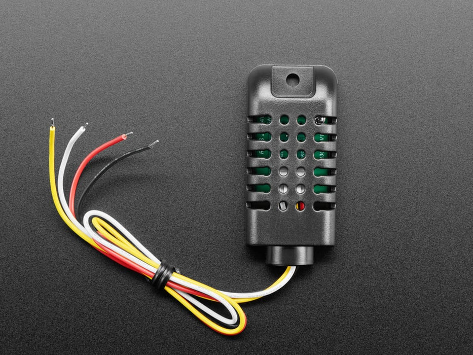 Top view of black humidity sensor sensor wired to a breadboard with an FeatherWing OLED display. The OLED shows the data from the temperature-humidity sensor.