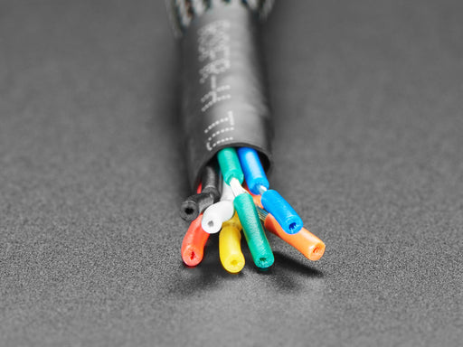 Video of a white hand pressing a metal pushbutton with a glowing rainbow LED ring.