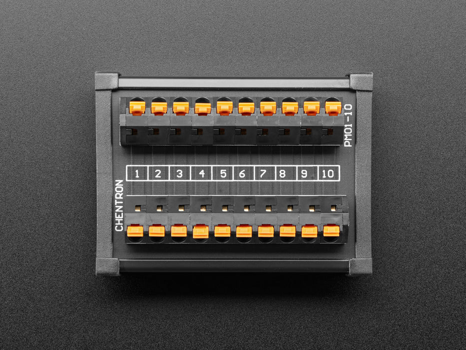 Angled shot of DIN Rail 10x10 to Terminal Block Adapter on a DIN rail.