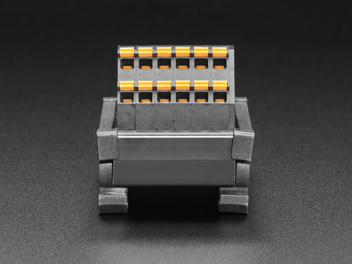 Angled shot of DIN Rail 6x6 to Terminal Block Adapter on a DIN rail.