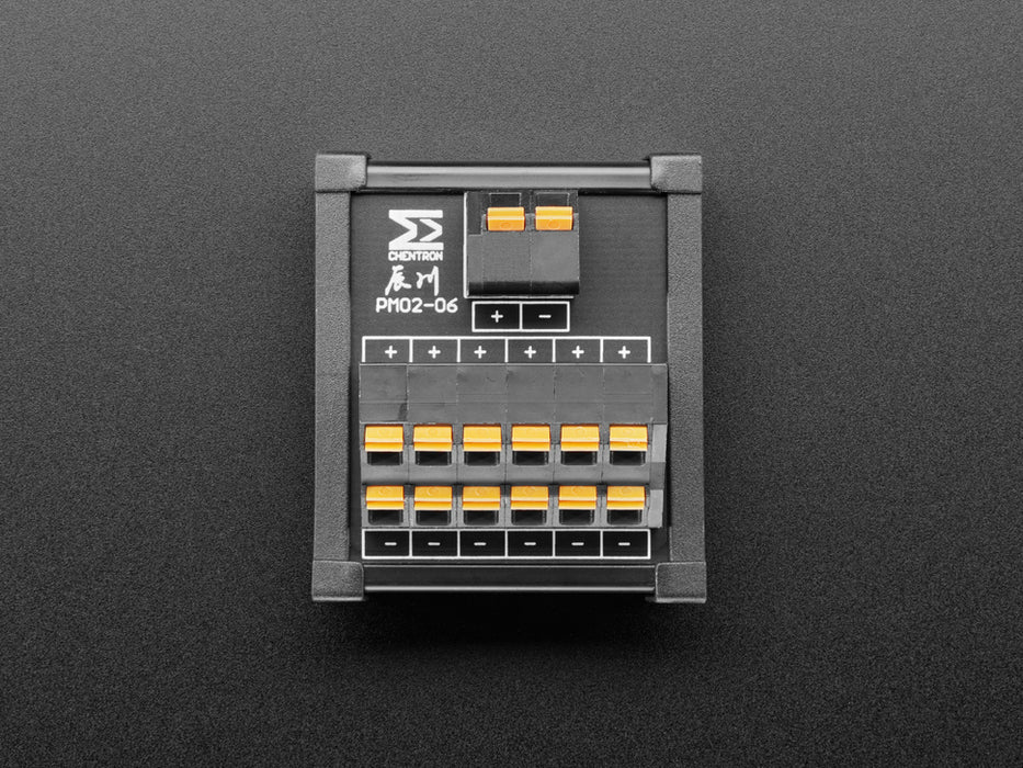 Angled shot of DIN Rail 6x6 to Terminal Block Adapter on a DIN rail.