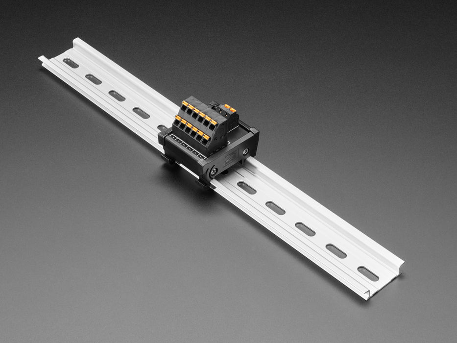 Angled shot of DIN Rail 6x6 to Terminal Block Adapter on a DIN rail.