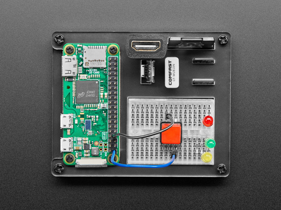 Top shot of a green rectangular microcontroller assembled in a dock work station with peripheries and accessories.