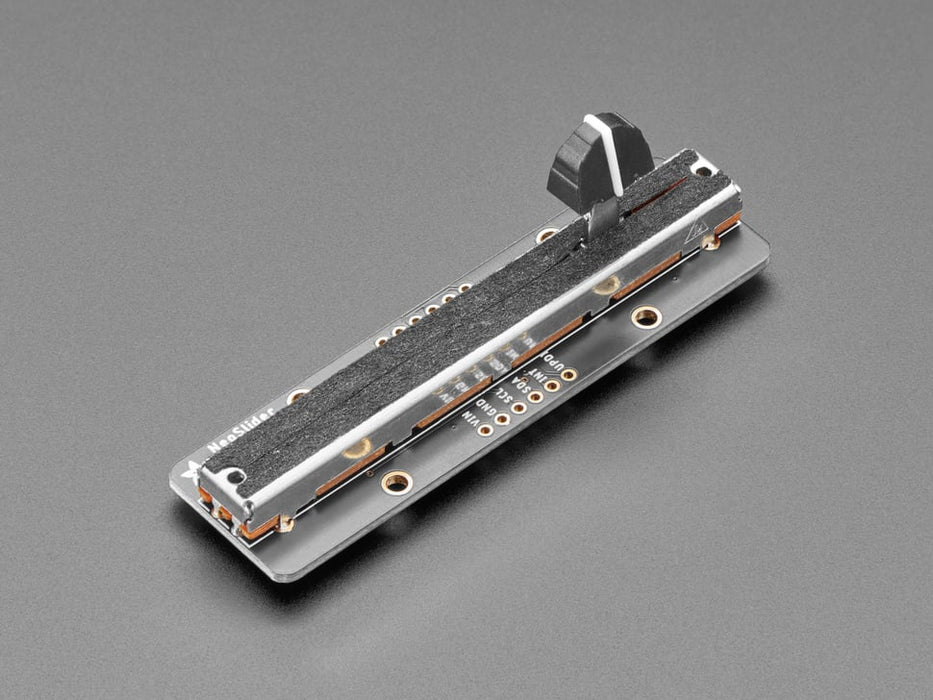 Long rectangular breakout board with a slide potentiometer changing colors as a hand moves up and down.