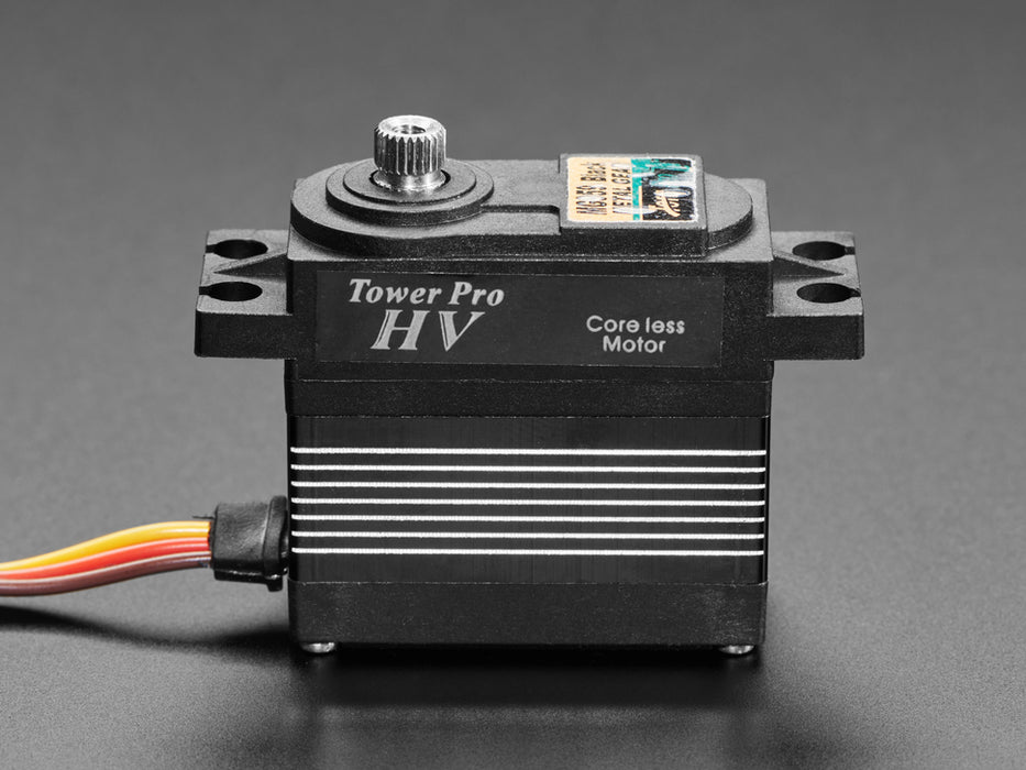 Angled shot of black servo motor with 3-pin jumper cable.