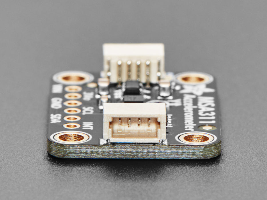 Angled shot of black accelerometer breakout board.