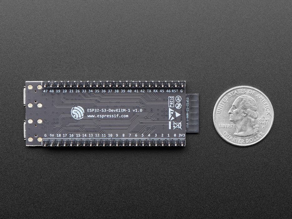 Angled shot of black rectangular microcontroller with a wifi module.