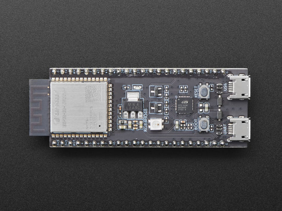 Angled shot of black rectangular microcontroller with a wifi module.