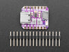 Angled shot of small square purple dev board.