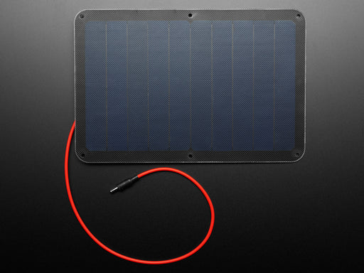 Angled shot of large solar panel with red cable.