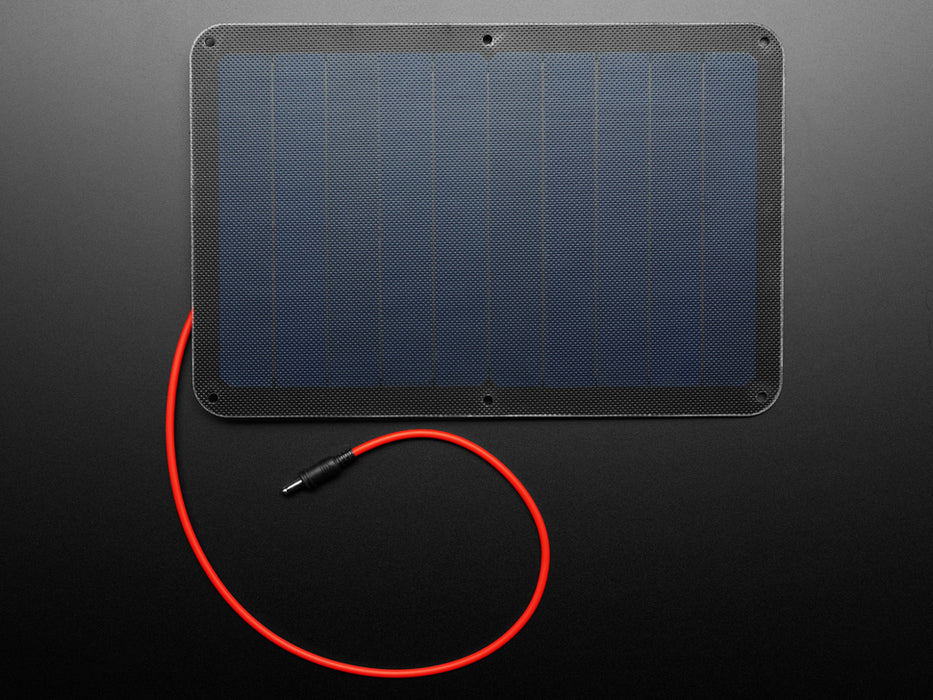 Angled shot of large solar panel with red cable.