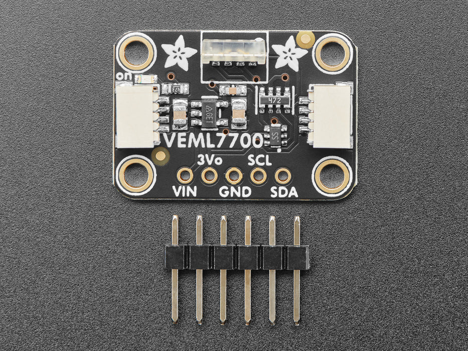 Angled shot of black rectangular breakout board with vertical light sensor.