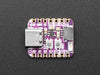 Angled shot of purple square-shaped microcontroller.