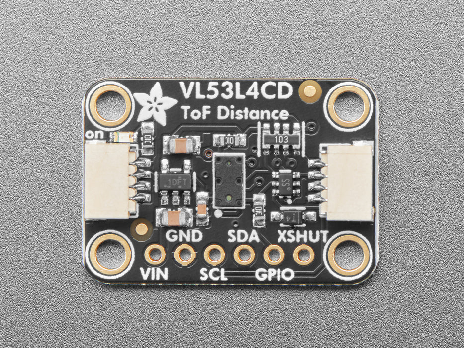 Video of a hand hovering over a Adafruit VL53L4CD Time of Flight Distance Sensor thats connected to a white breadboard reading the range of motion of the hand. 