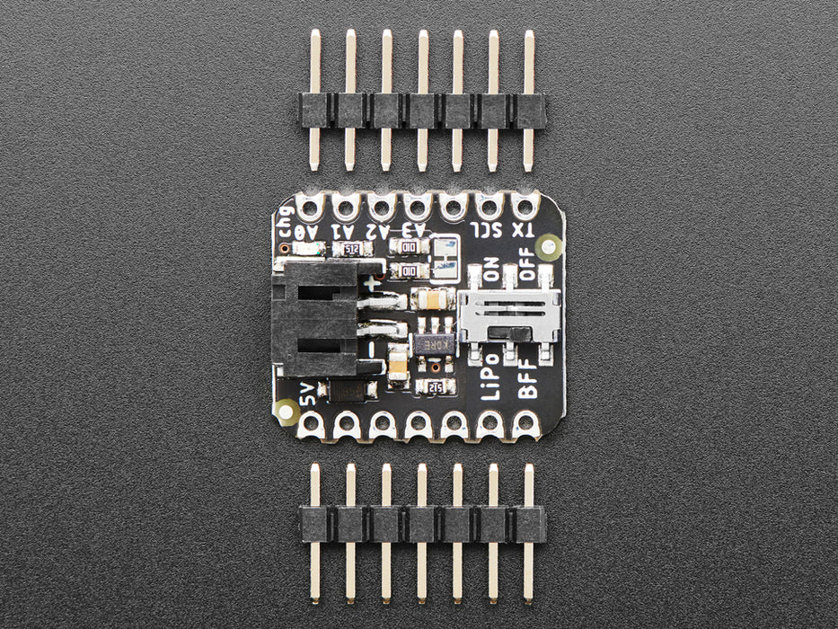 Video of a person with white painted nails unplugging a USB cable from a small, black, square-shaped lipo battery breakout board soldered to a similarly shaped microcontroller, which is also connected to a monochrome OLED display breakout. The OLED breakout displays battery and power data.