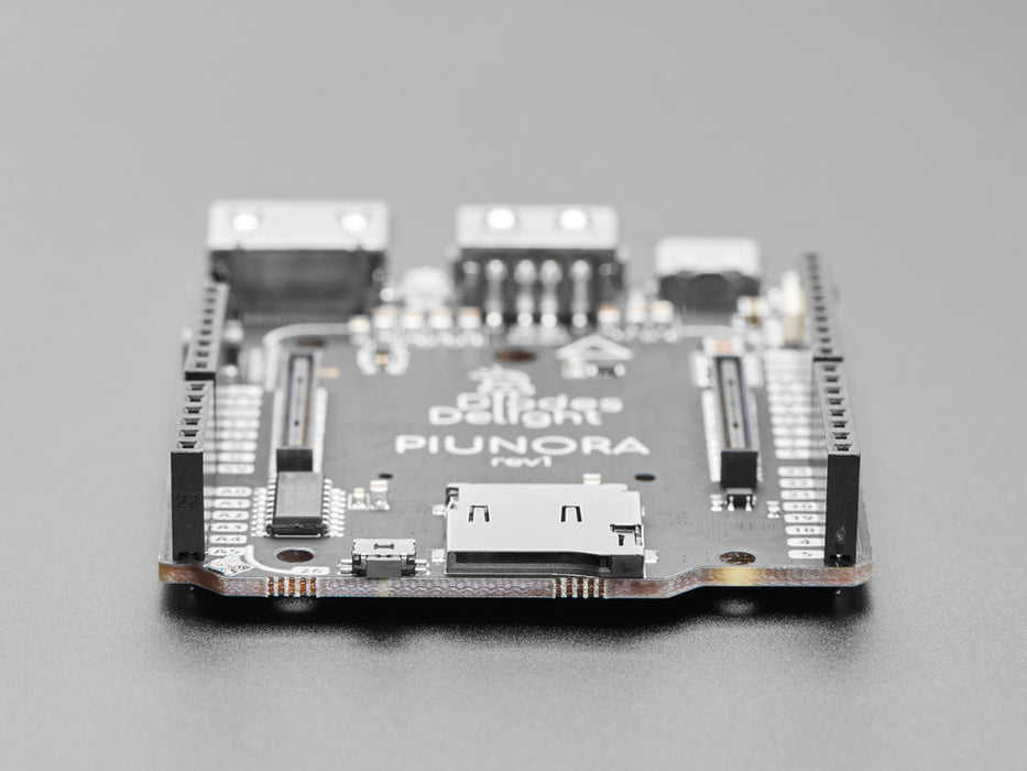 Rectangular compute module placed on a bigger microcontroller.