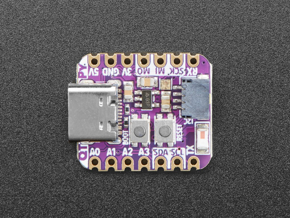 Angled shot of an Adafruit QT Py ESP32-C3 WiFi Dev Board with STEMMA QT.