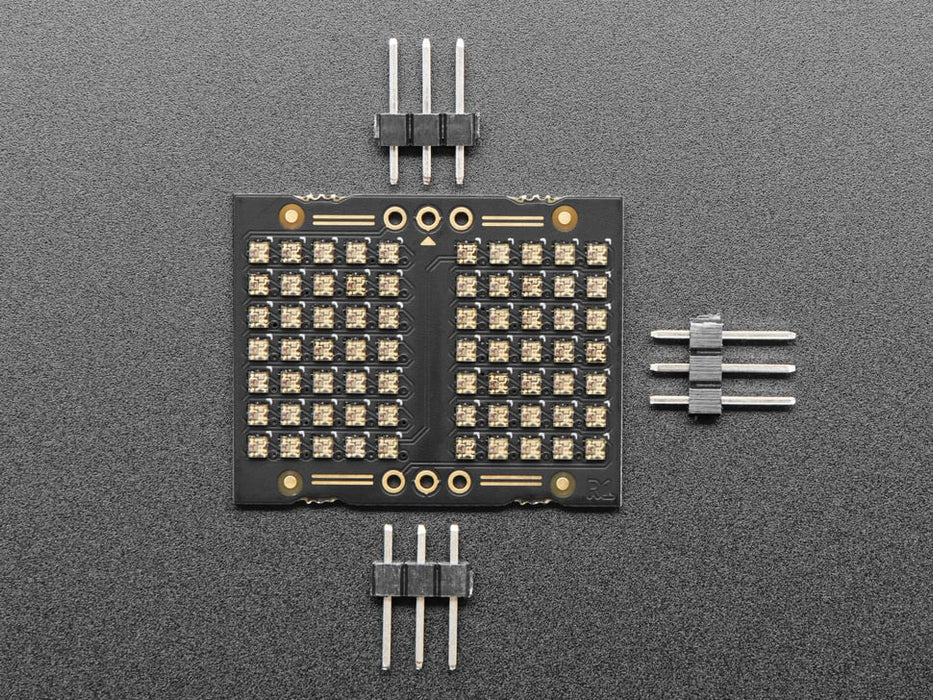 Video of an LED matrix board on a half-size breadboard counting up numbers in rainbow colors.