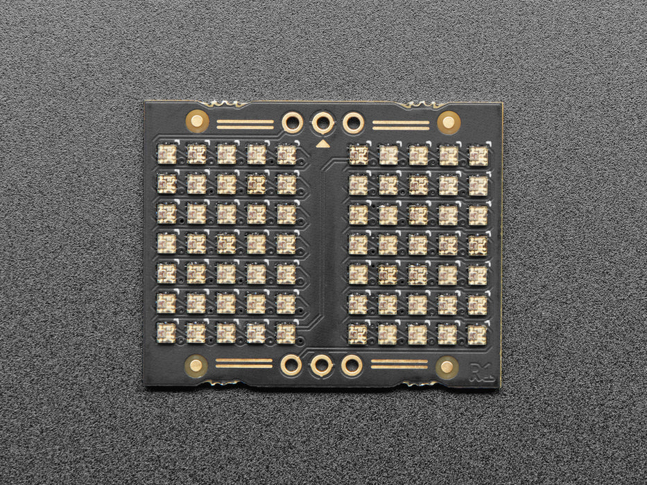 Video of an LED matrix board on a half-size breadboard counting up numbers in rainbow colors.