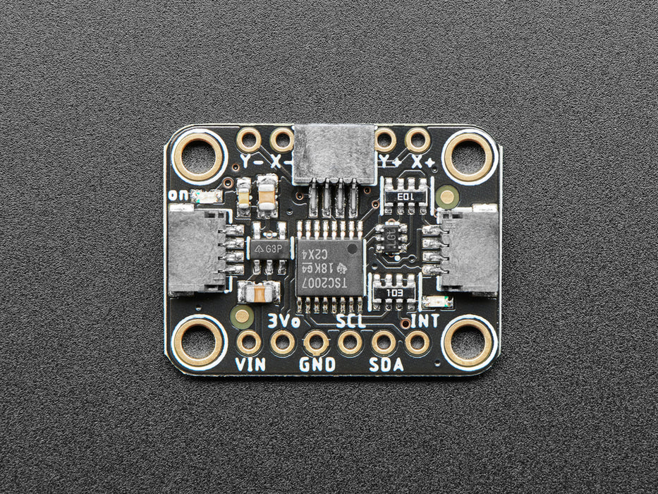 Video of a mushroom-manicured finger pressing a clear touchscreen display. The x-axis and y-axis dimensions are displayed on the connected monochrome OLED display breakout board.