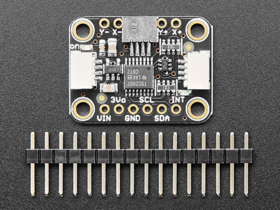 Video of a mushroom-manicured finger pressing a clear touchscreen display. The x-axis and y-axis dimensions are displayed on the connected monochrome OLED display breakout board.