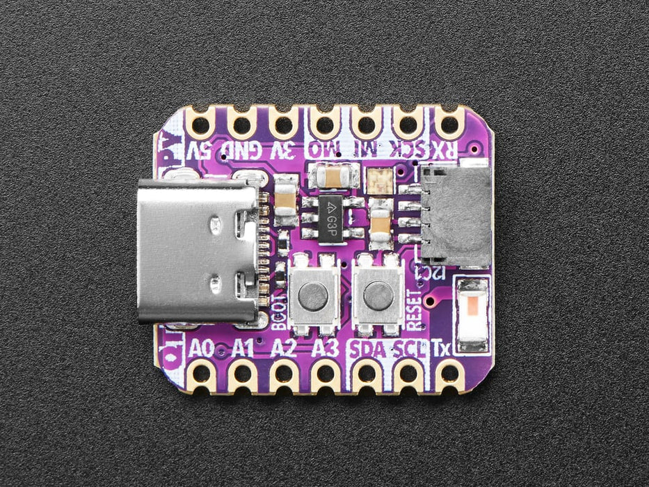 Angled shot of small purple microcontroller.