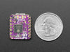 Angled shot of small purple microcontroller.