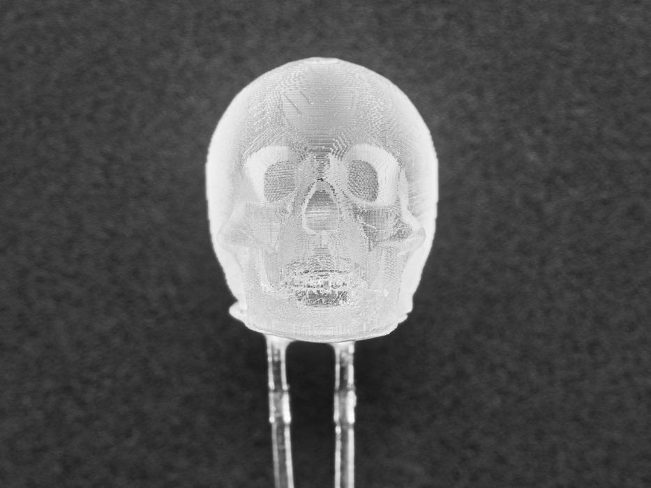 Video of a skull-shaped LED emitting cool white light.