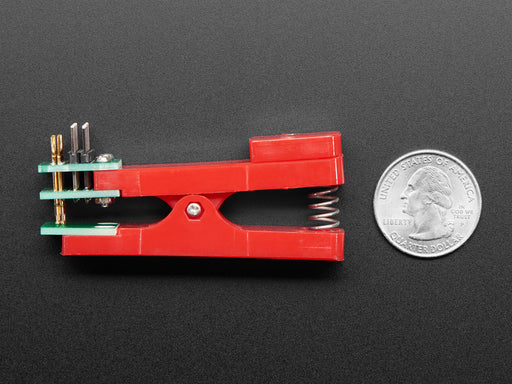 Pogo Pin Probe Clip clipped to a PCB with 2x5 pads.