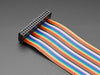 Angled shot of rainbow-colored 34-pin IDC ribbon cable.