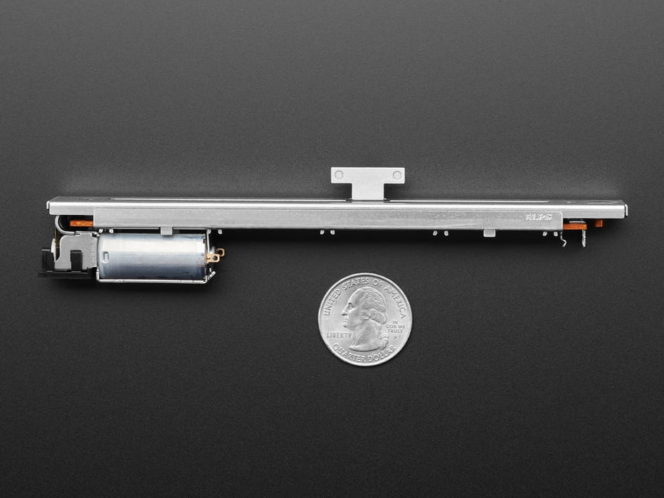 Video of a motorized slide potentiometer sliding back and forth. A white finger pushes the knob to the middle of the track, and it resumes sliding back and forth.