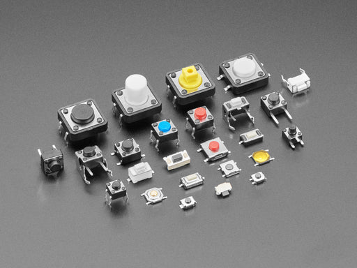 Overhead shot of dozens of different sized and colored packs of tactile switches.