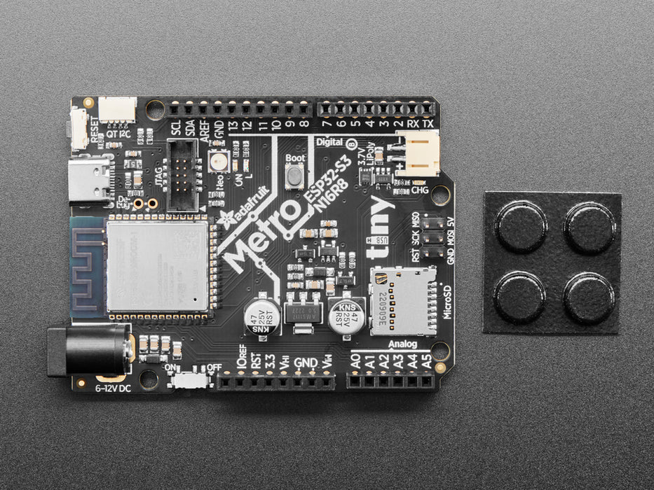 Angled shot of black, credit-card-sized dev board.