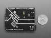 Angled shot of black, credit-card-sized dev board.