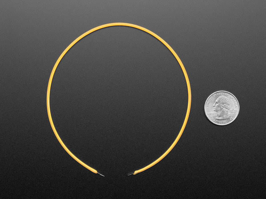 Video of a pair of white hands coiling and playing with a 300mm long red LED filament.