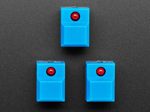 Angled shot of three blue step-switches with LEDs.