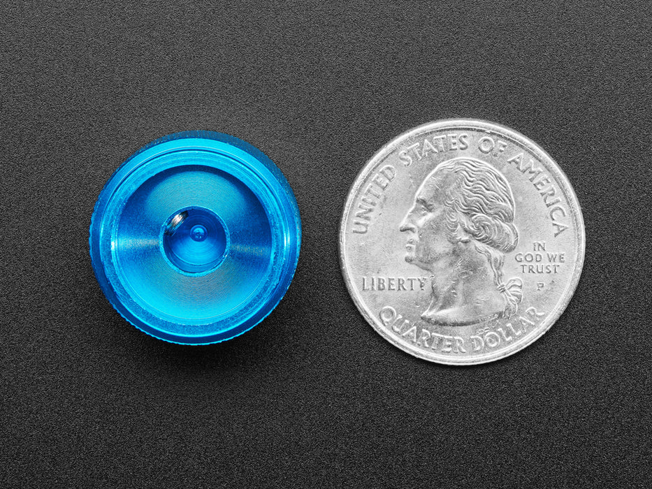 Angled shot of a blue aluminum knob. A white triangle on top of the knob points at 7:00. 