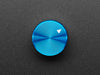 Angled shot of a blue aluminum knob. A white triangle on top of the knob points at 7:00. 